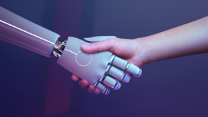 robot hand and human hand meet in a handshake